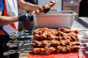 a man strands pickled meat on a skewer street foo 2025 01 10 20 40 30 utc 1