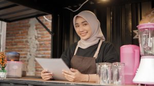 beautiful smiling asian waitress carrying menu lis 2025 01 10 15 15 14 utc