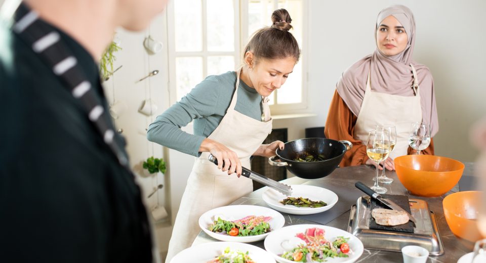 young female with frying pan bending over large ki 2025 03 14 07 59 26 utc