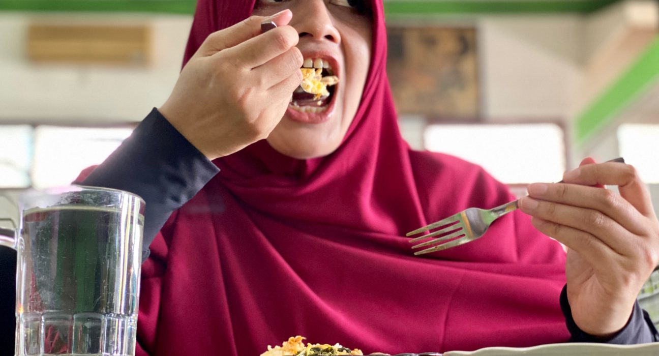 young woman having lunch and take a bite for rice 2024 12 01 15 18 18 utc