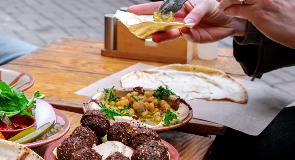 close up of women s hands holding bread and spread 2025 03 08 04 27 09 utc