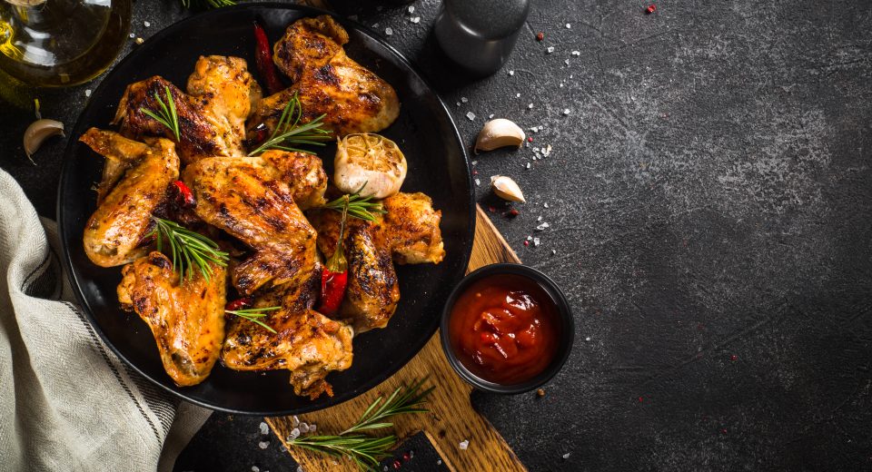 grilled chicken wings with spices at black table 2025 02 12 10 38 31 utc