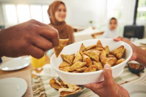 food samosa and muslim with hands of people at ta 2025 04 06 10 15 23 utc