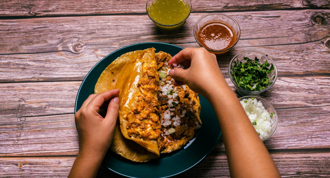 hands of a person preparing a gringa pastor a la d 2025 03 11 14 18 26 utc