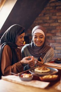 happy middle eastern women using smart phone durin 2024 12 13 18 20 59 utc 1