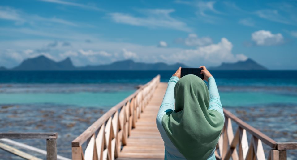 hijab woman taking photo of the scenery using mobi 2025 03 08 20 26 17 utc