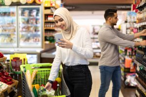islamic lady doing grocery shopping using mobile p 2025 03 18 18 15 30 utc
