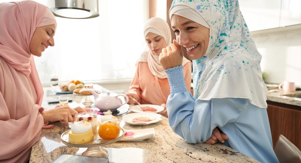 joyful muslim women dining together and talking in 2024 10 18 09 07 52 utc