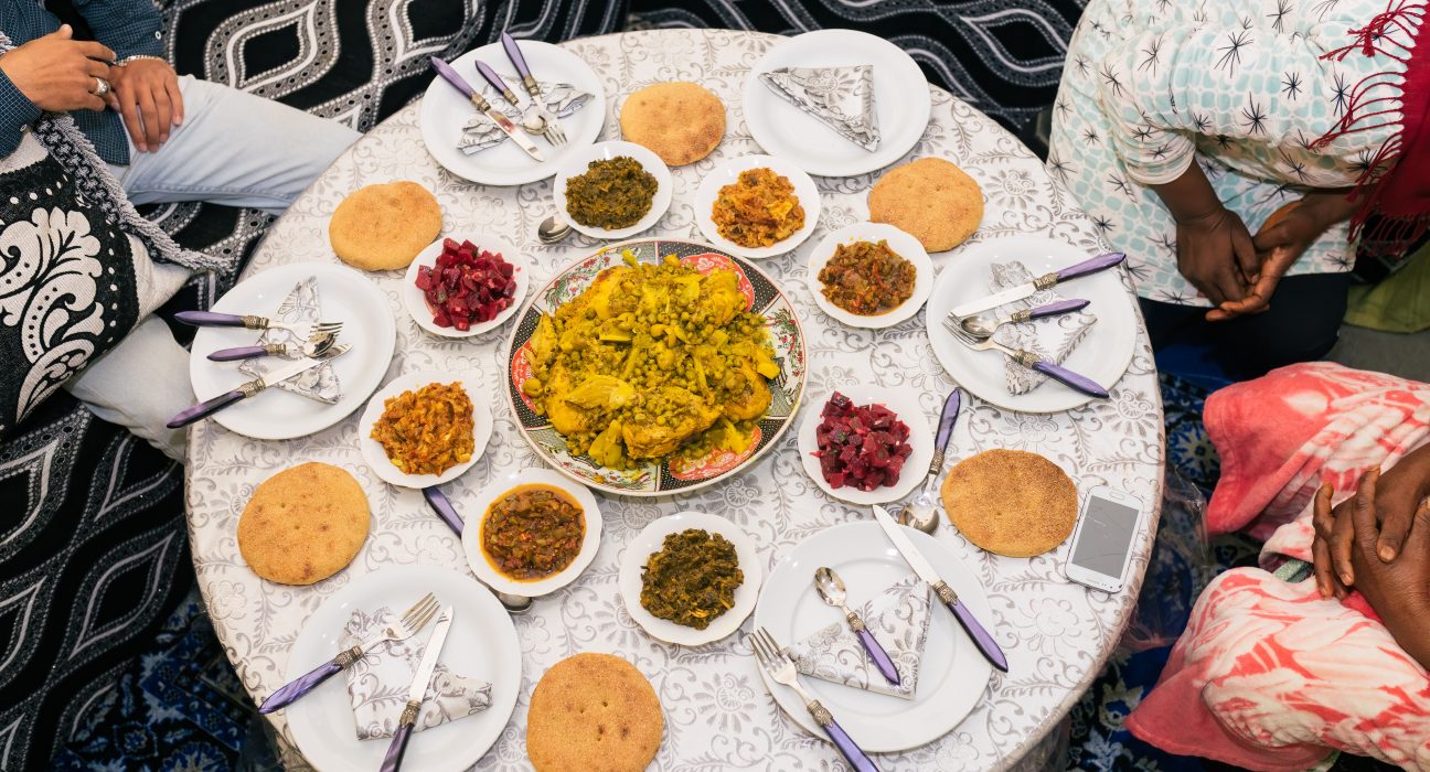 unrecognizable men and woman sitting at dinner tab 2025 01 09 06 05 49 utc