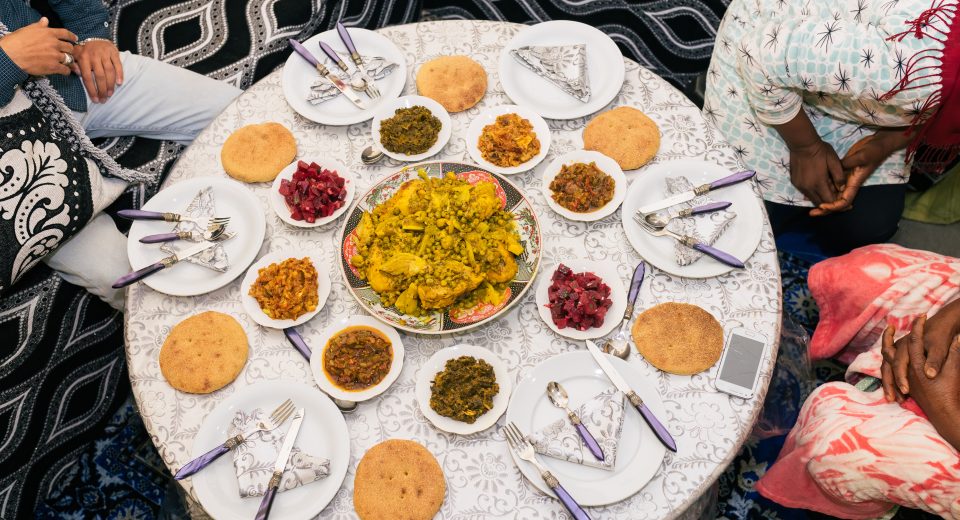 unrecognizable men and woman sitting at dinner tab 2025 01 09 06 05 49 utc