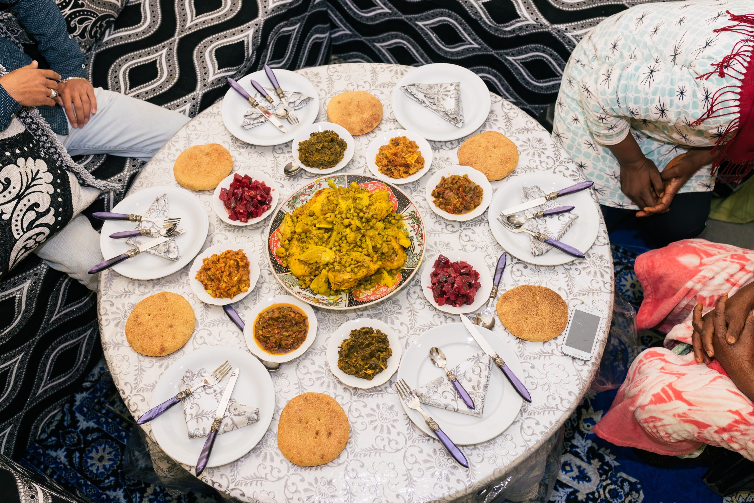 unrecognizable men and woman sitting at dinner tab 2025 01 09 06 05 49 utc scaled