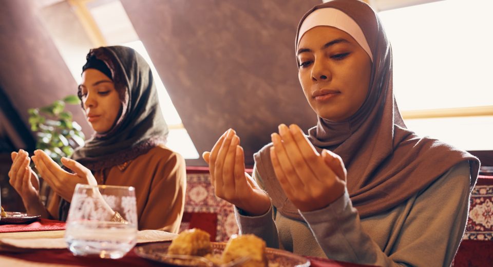 young muslim women praying while having dessert at 2024 12 13 18 32 21 utc