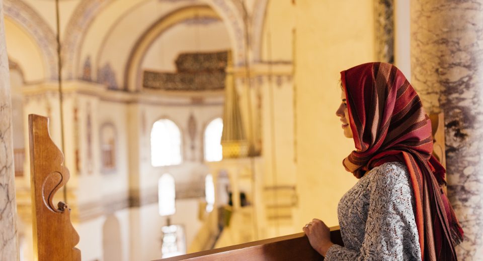 Staying Spiritually Connected While Traveling: A Muslim’s Guide 6 young woman in mosque wearing headscarf istanbul 2025 04 03 05 53 22 utc